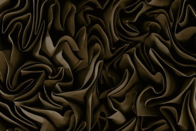 an abstract image of a brown and black background
